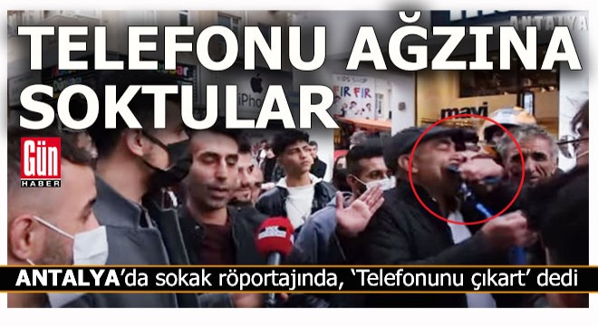 Antalya'da 'Telefonunu çıkart' diyen adamın ağzına telefon soktular