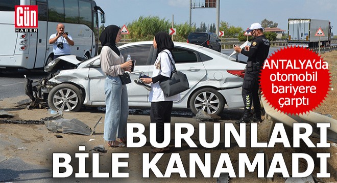 Antalya da bariyere çarpan otomobilden yara almadan çıktılar