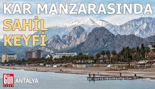 Antalya'da karlı dağ manzarasında sahil keyfi