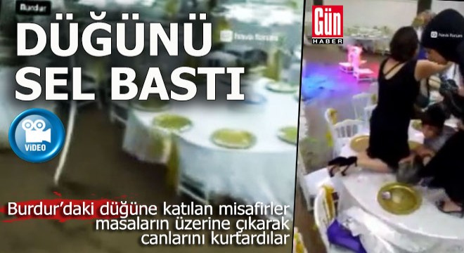 Burdur da düğün sırasında salonu sel bastı, misafirler masalara çıktı