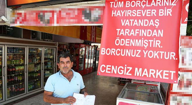 Hayırsever, marketin veresiye defterini satın aldı