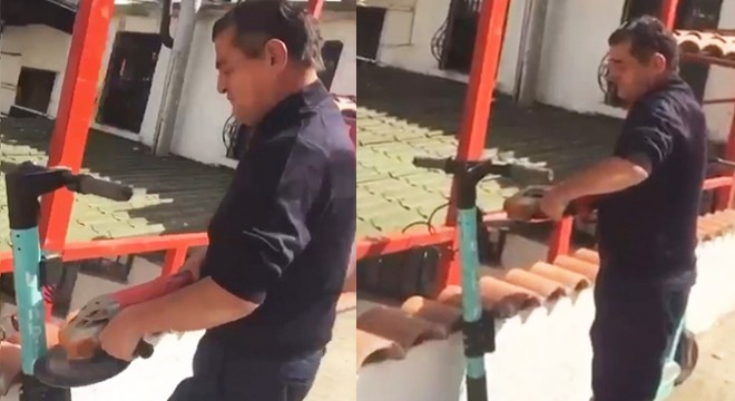 İş yerinin önüne bırakılan skuterleri spiralle kesti