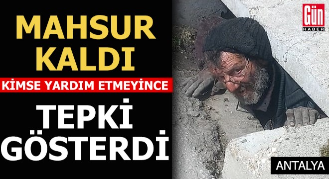 Kanalda mahsur kaldı, yardım etmeyenlere tepki gösterdi