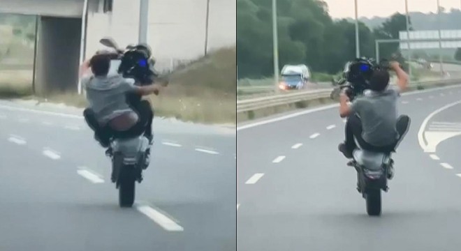 Motosikletlinin tek teker üzerindeki tehlikeli yolculuğu kamerada