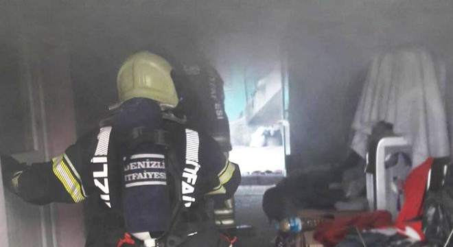 Yangında mahsur kalan kadını itfaiye kurtardı