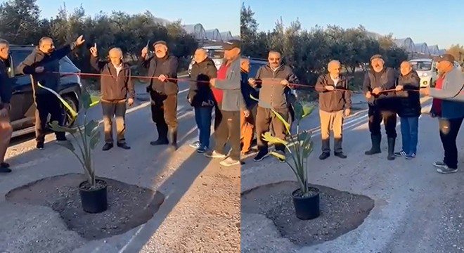Yolda kapatılmayan çukurlara 'çiçekli saksı' ile tepki