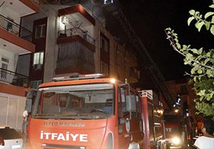 Yangında mahsur kalan çocuğu komşuları kurtardı