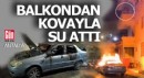 Yanan otomobili balkondan su atarak söndürmeye çalıştı